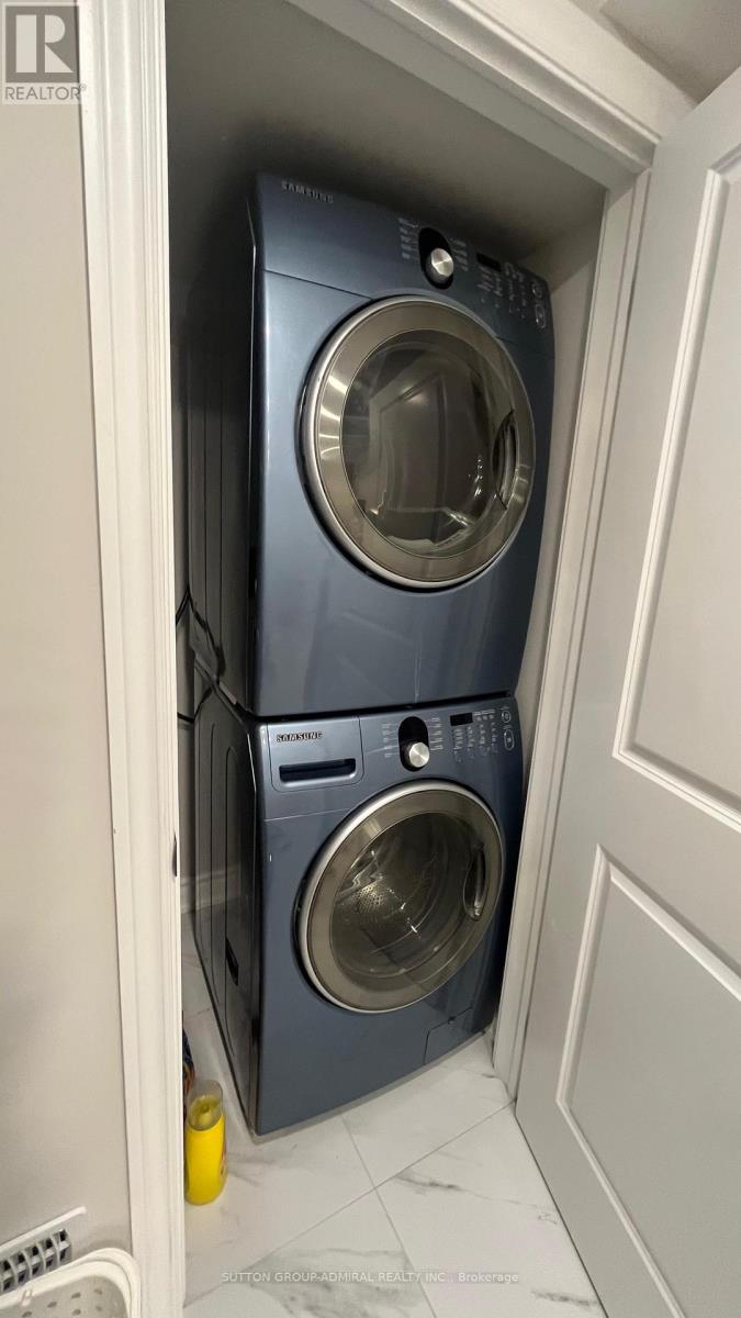A washing machine is in a small space.
