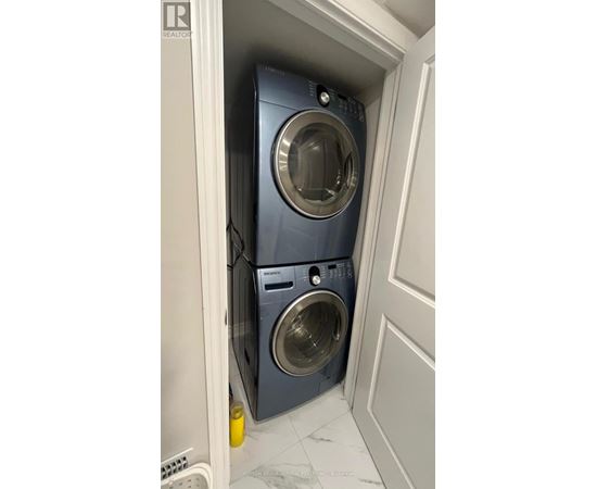 A washing machine is in a small space.