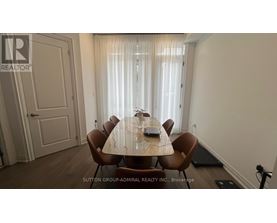 A dining room with a table set for six.