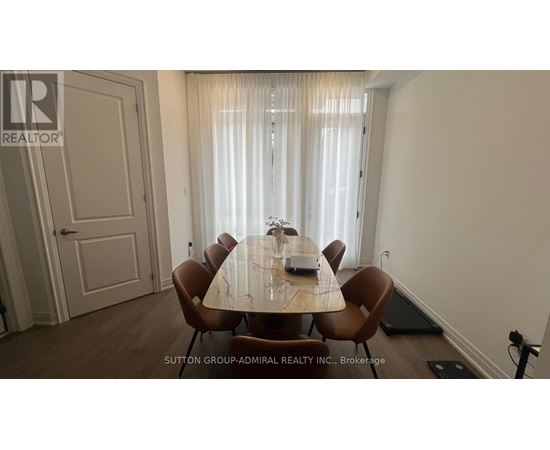 A dining room with a table set for six.