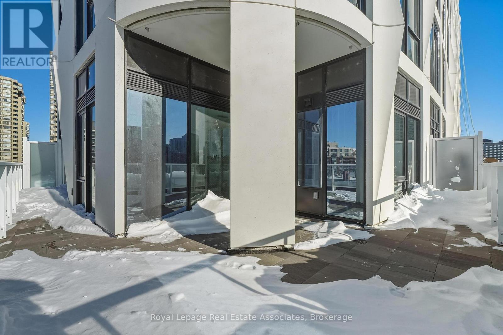 A building entrance with a sign that says REALTOR.