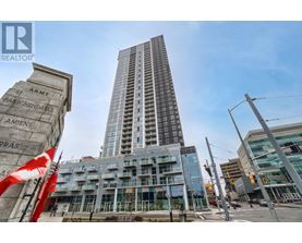 A tall building with a sign that reads "ARMY" in front of it.