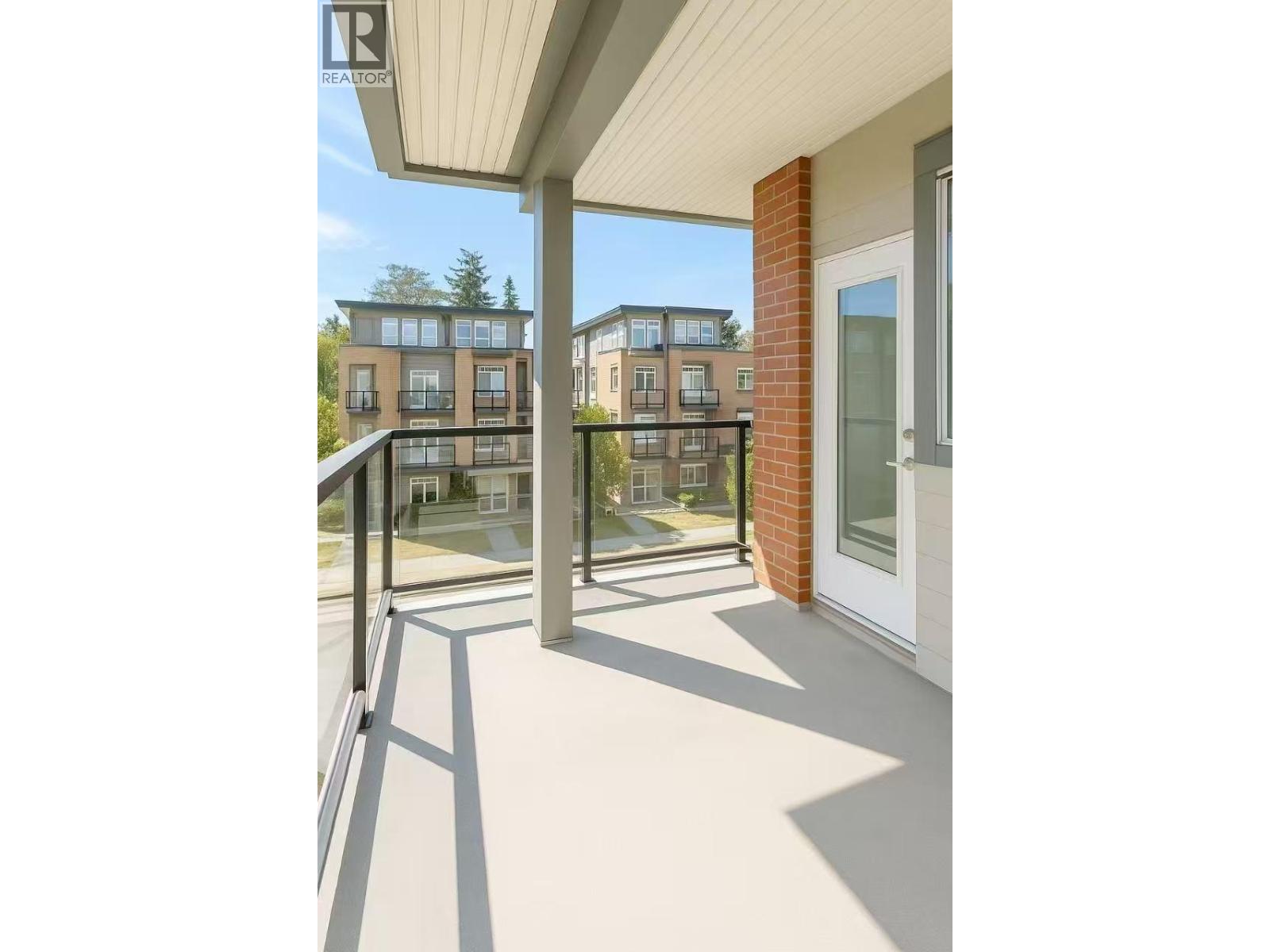 A balcony with a view of apartment buildings.
