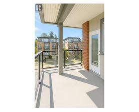 A balcony with a view of apartment buildings.