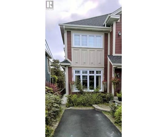 A house with a red brick exterior and a white door.