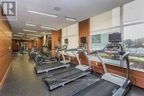 A gym with treadmills and exercise equipment.