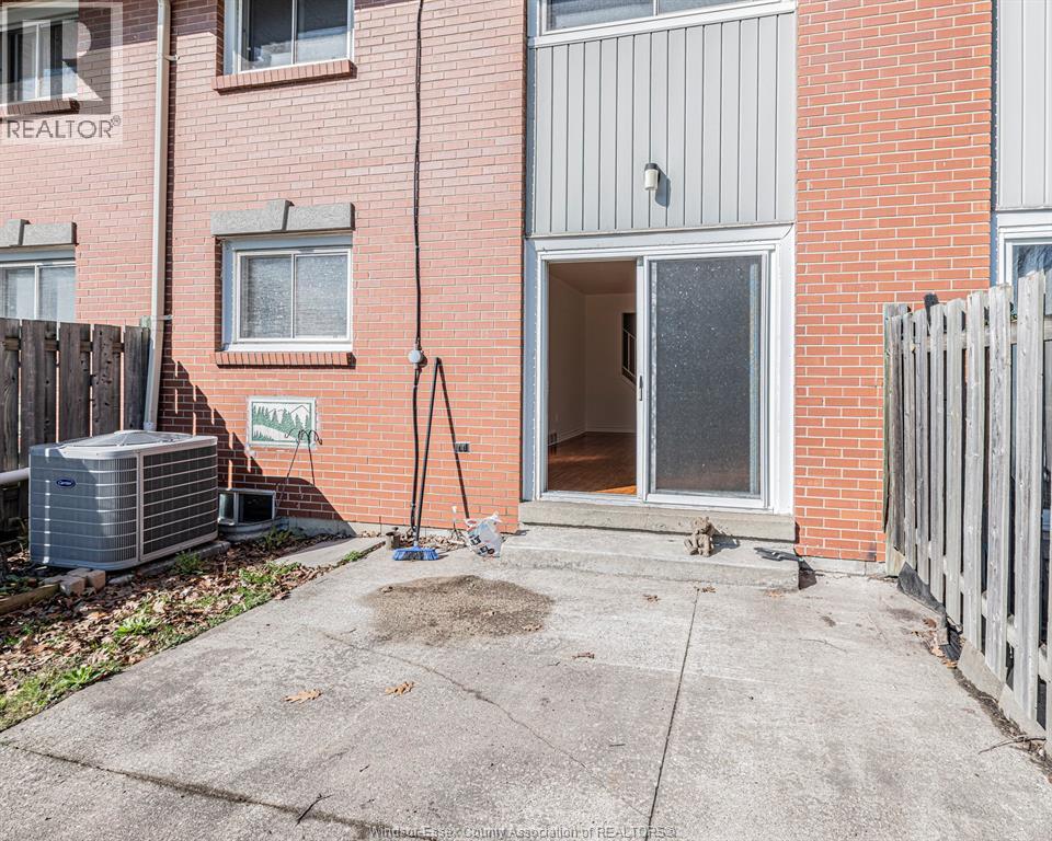 A red brick building with a sign that says "REALTOR" on it.