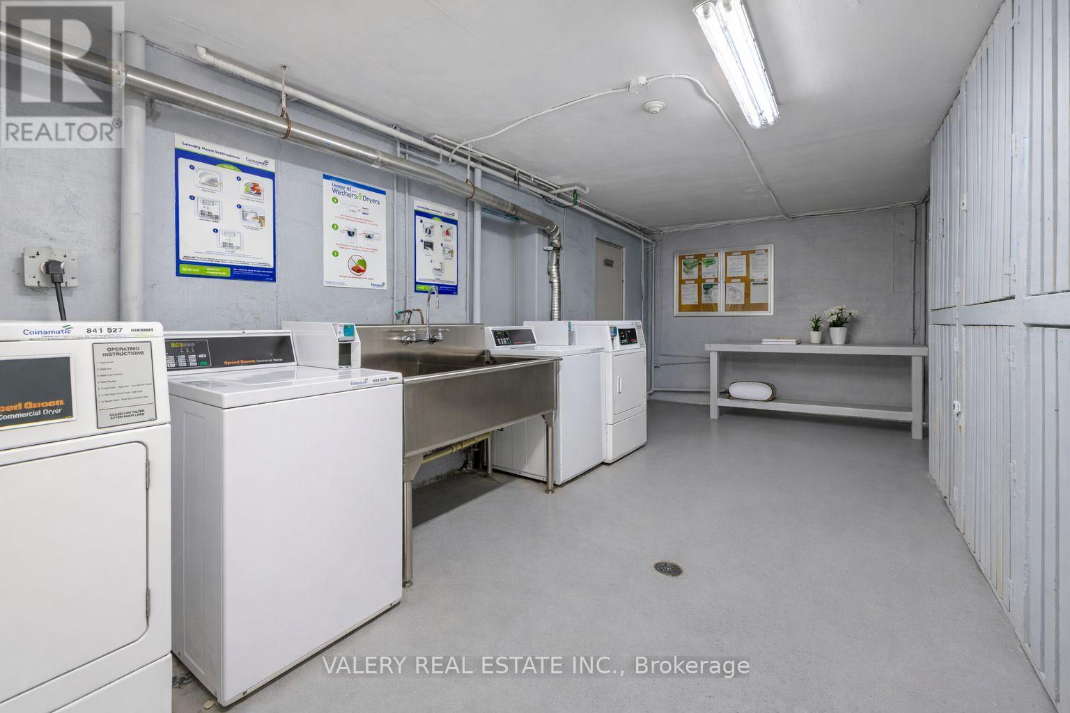 A brokerage office with white appliances and a white wall.