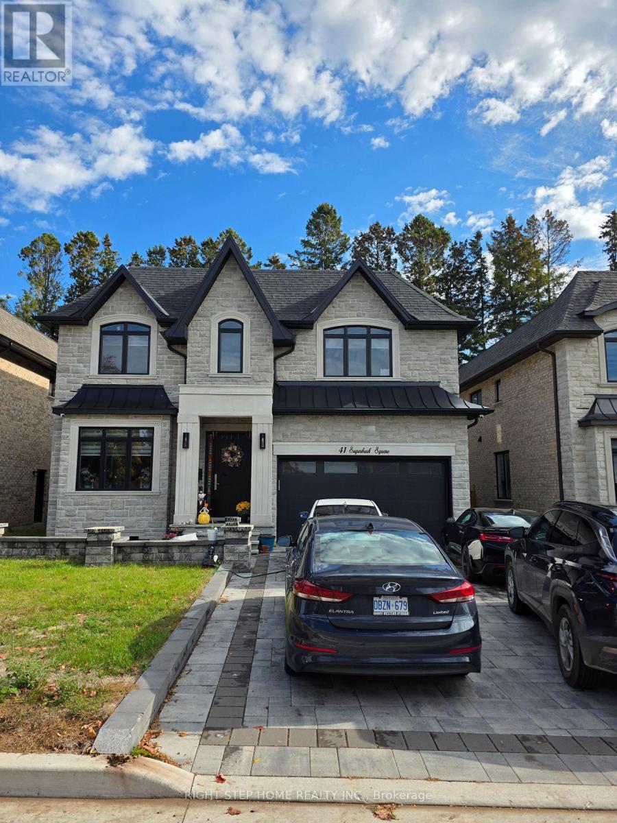 A house with a car parked in front.