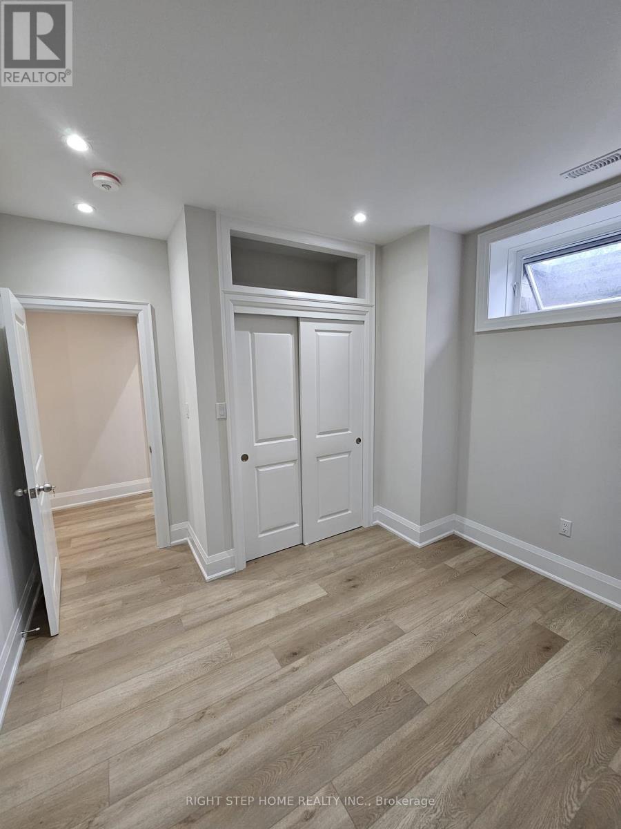 A room with a white door and a window.
