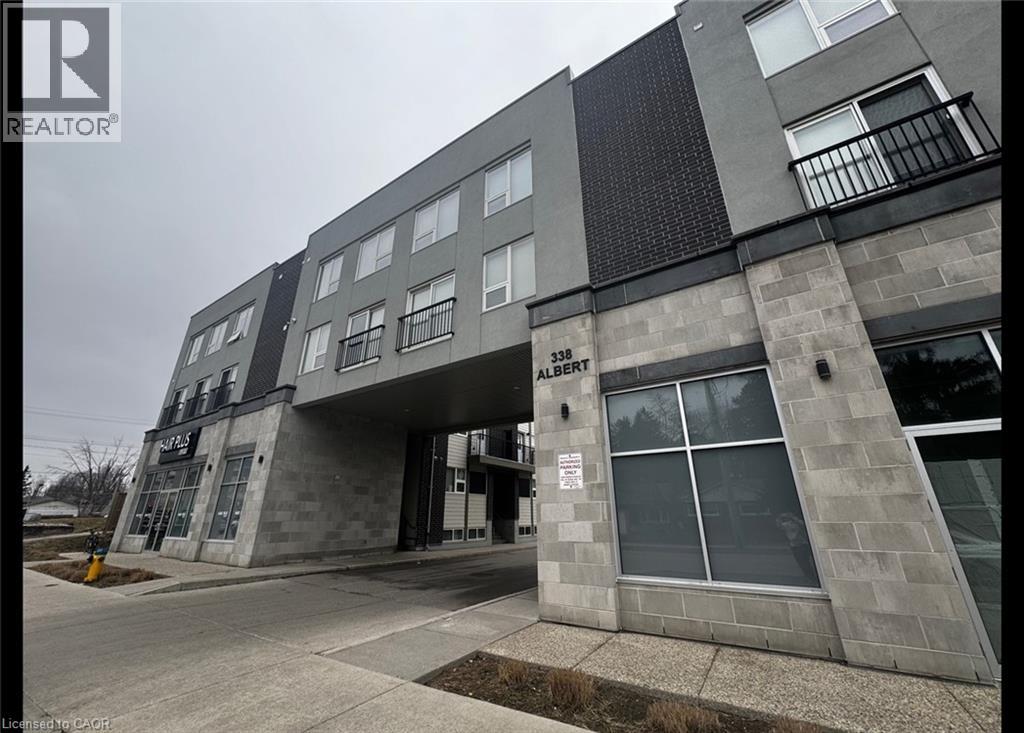 A grey building with the number 358 and the word Alberni on it.