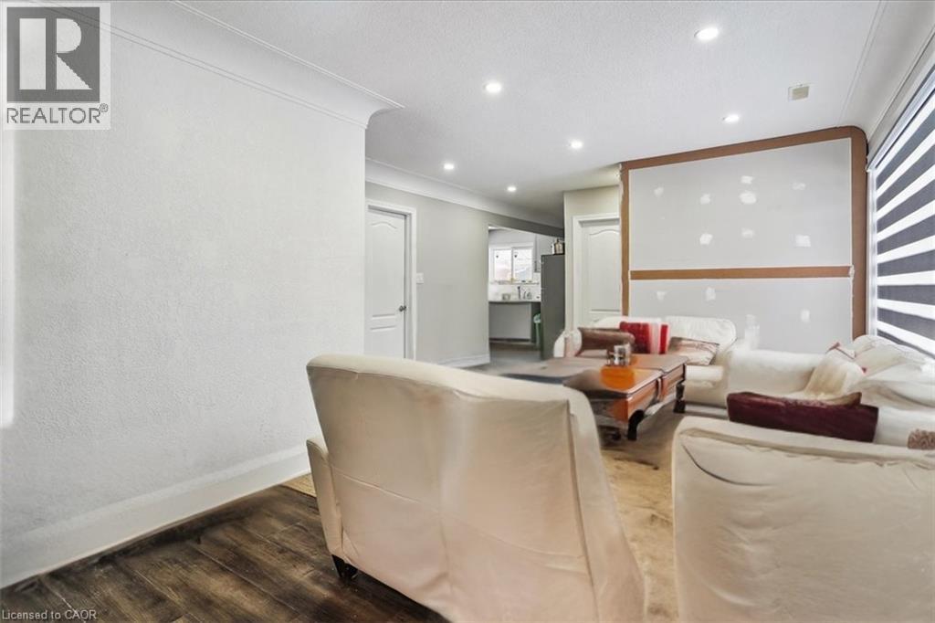 A living room with a couch, chair, and a coffee table.