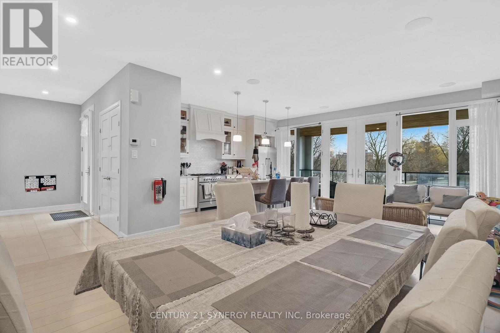 A spacious living room with a large couch and a coffee table.