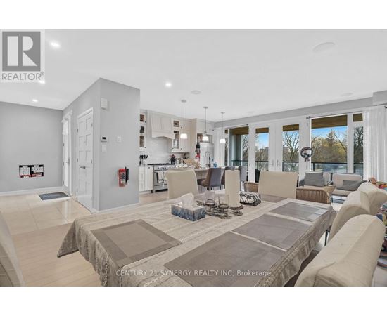 A spacious living room with a large couch and a coffee table.