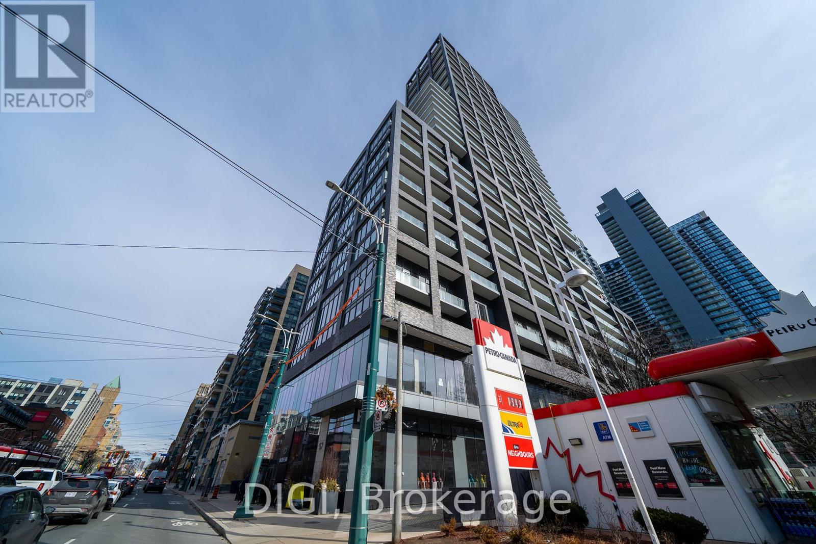 A tall building with a sign that says "REALTOR" in front of it.