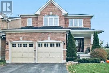 A large brick house with a white garage door.