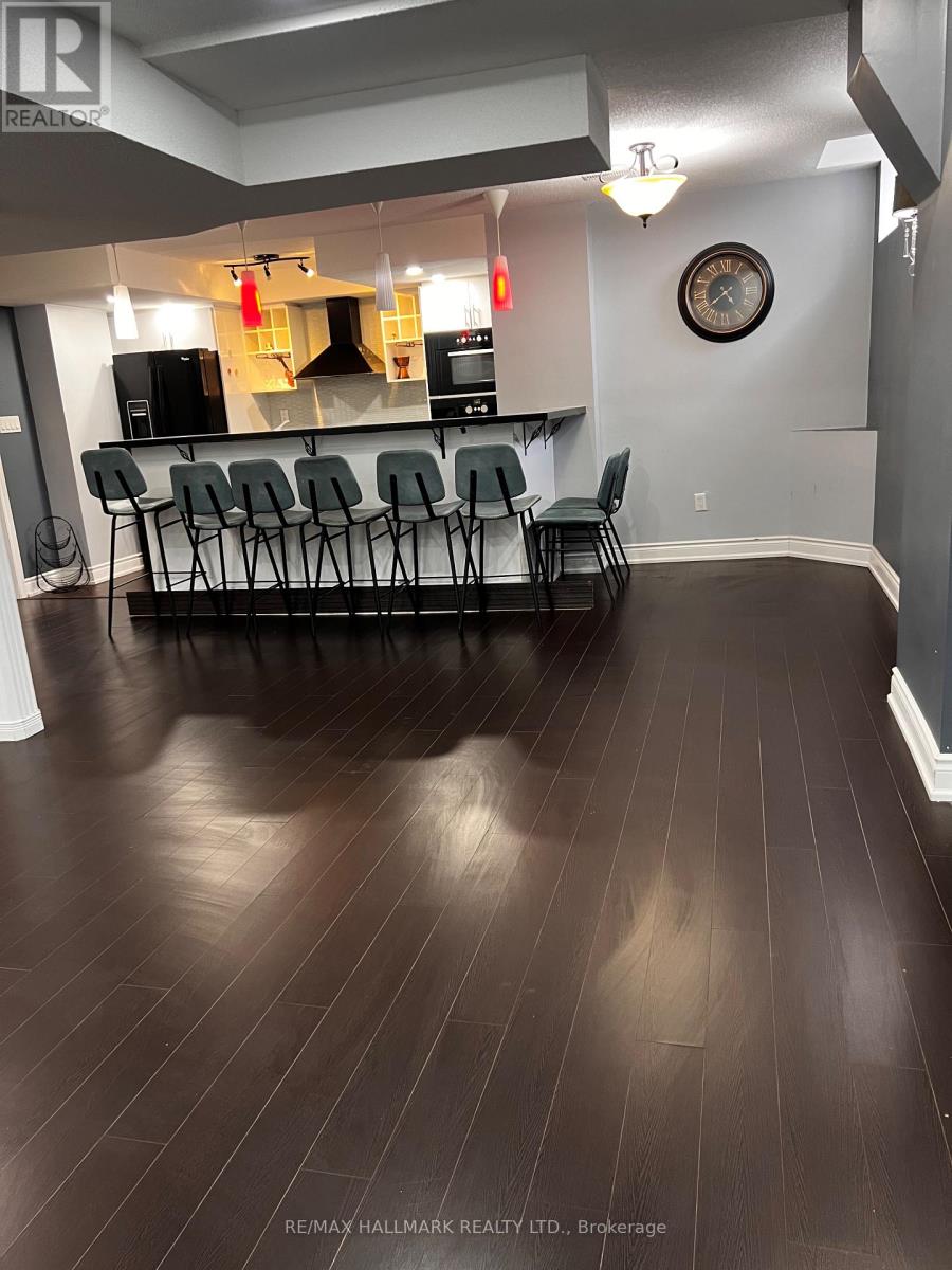 A room with a bar and chairs.