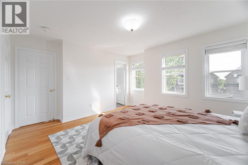 A bedroom with a large bed and a window.