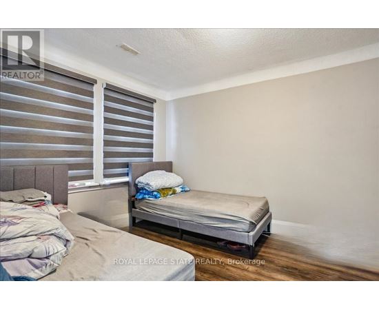 A bedroom with a bed and a single bed frame.