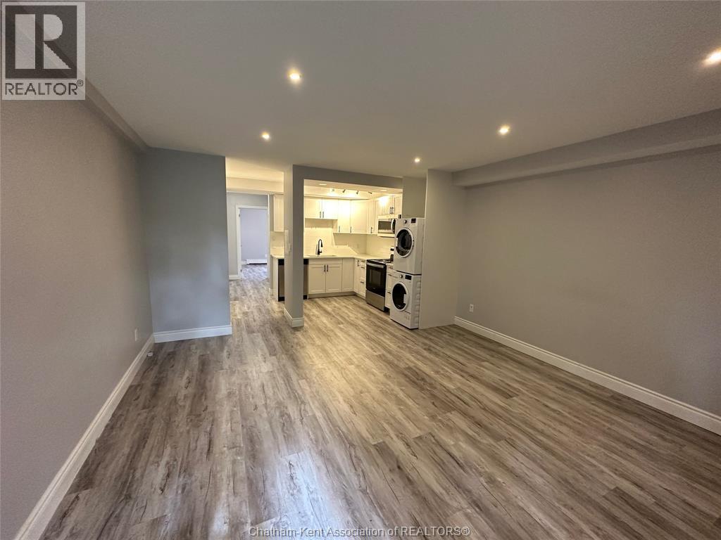 A room with a grey floor and a white ceiling.