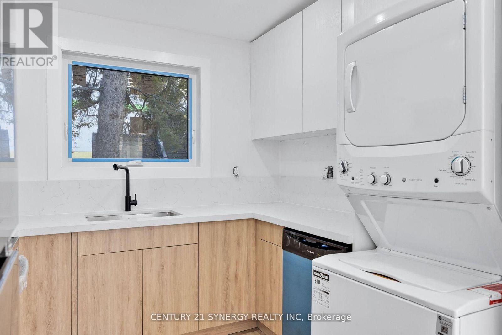 A kitchen with a white oven and wooden cabinets.
