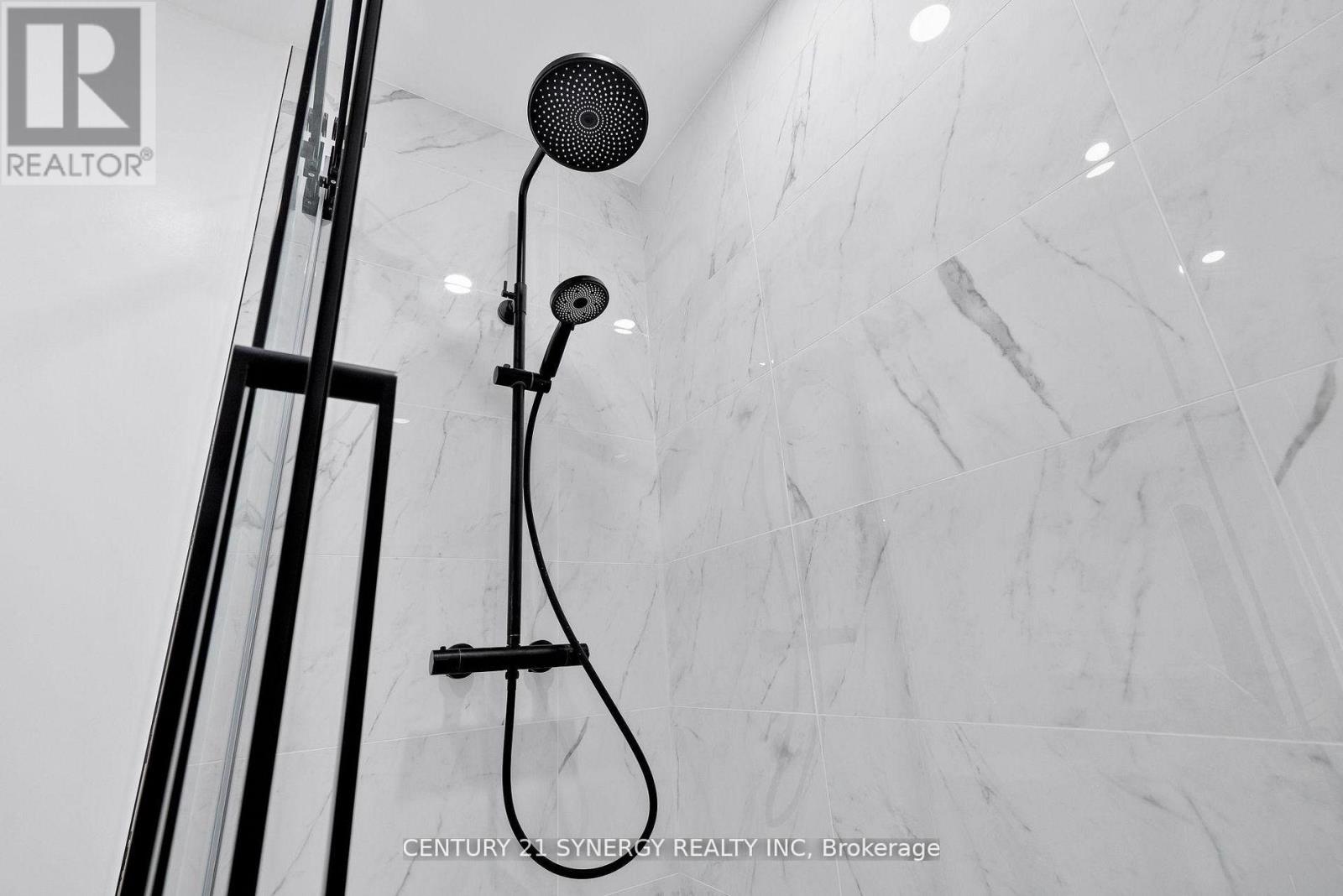 A shower head mounted on a wall.