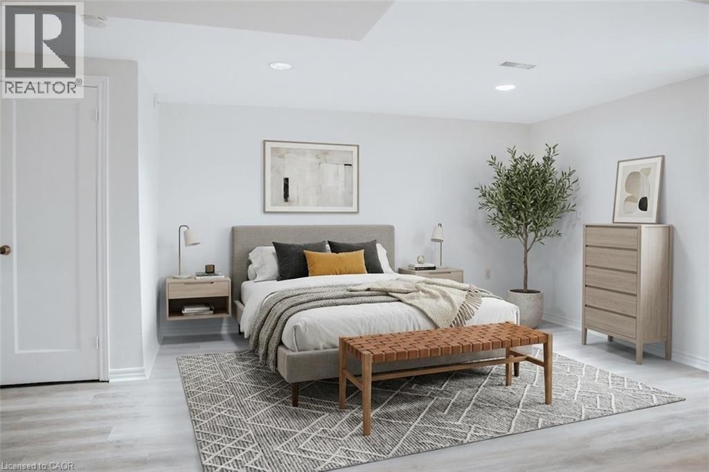 A bedroom with a large bed and a wooden bench.