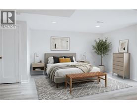 A bedroom with a large bed and a wooden bench.