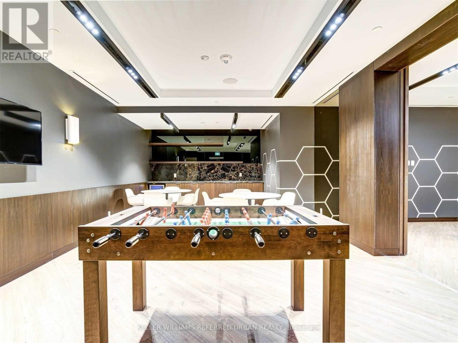 A billiard table with a pool table in the middle of the room.