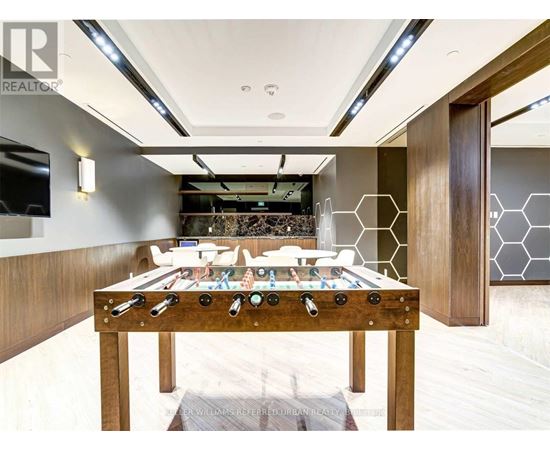 A billiard table with a pool table in the middle of the room.