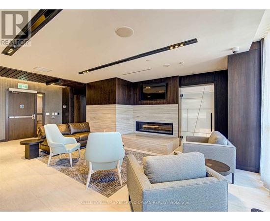 A modern living room with a fireplace and a television.