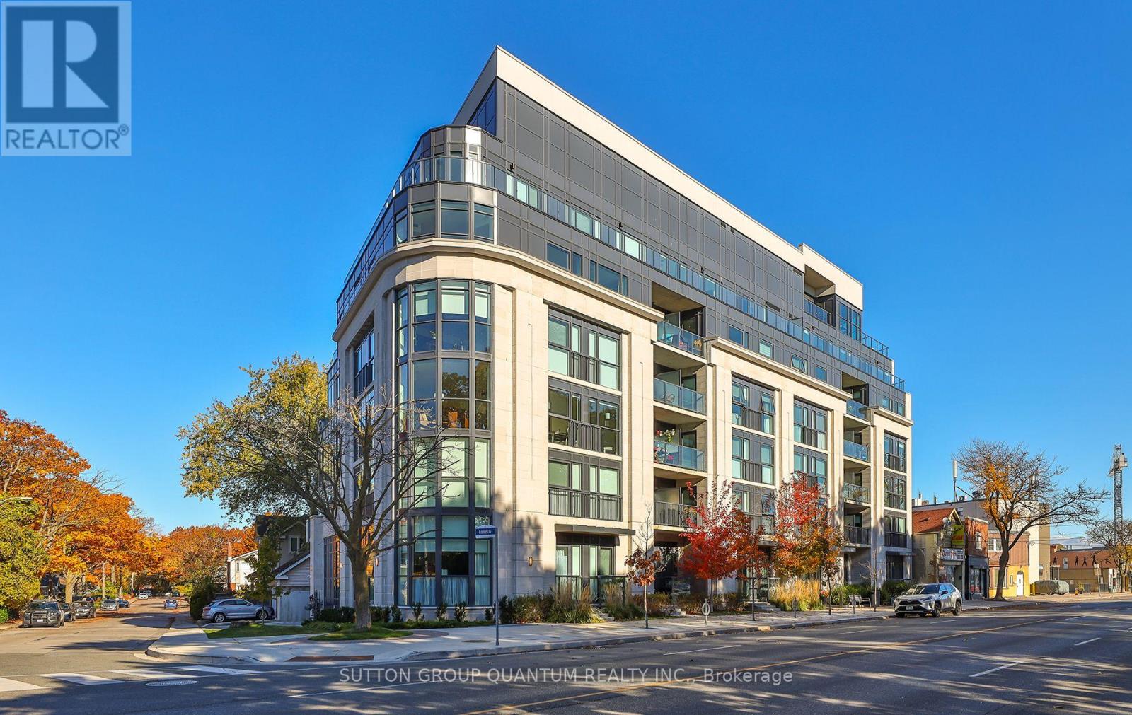 A modern multi-story building with a glass facade is the main focus of the image.