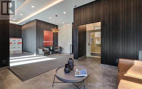 A modern living room with a coffee table in the center.
