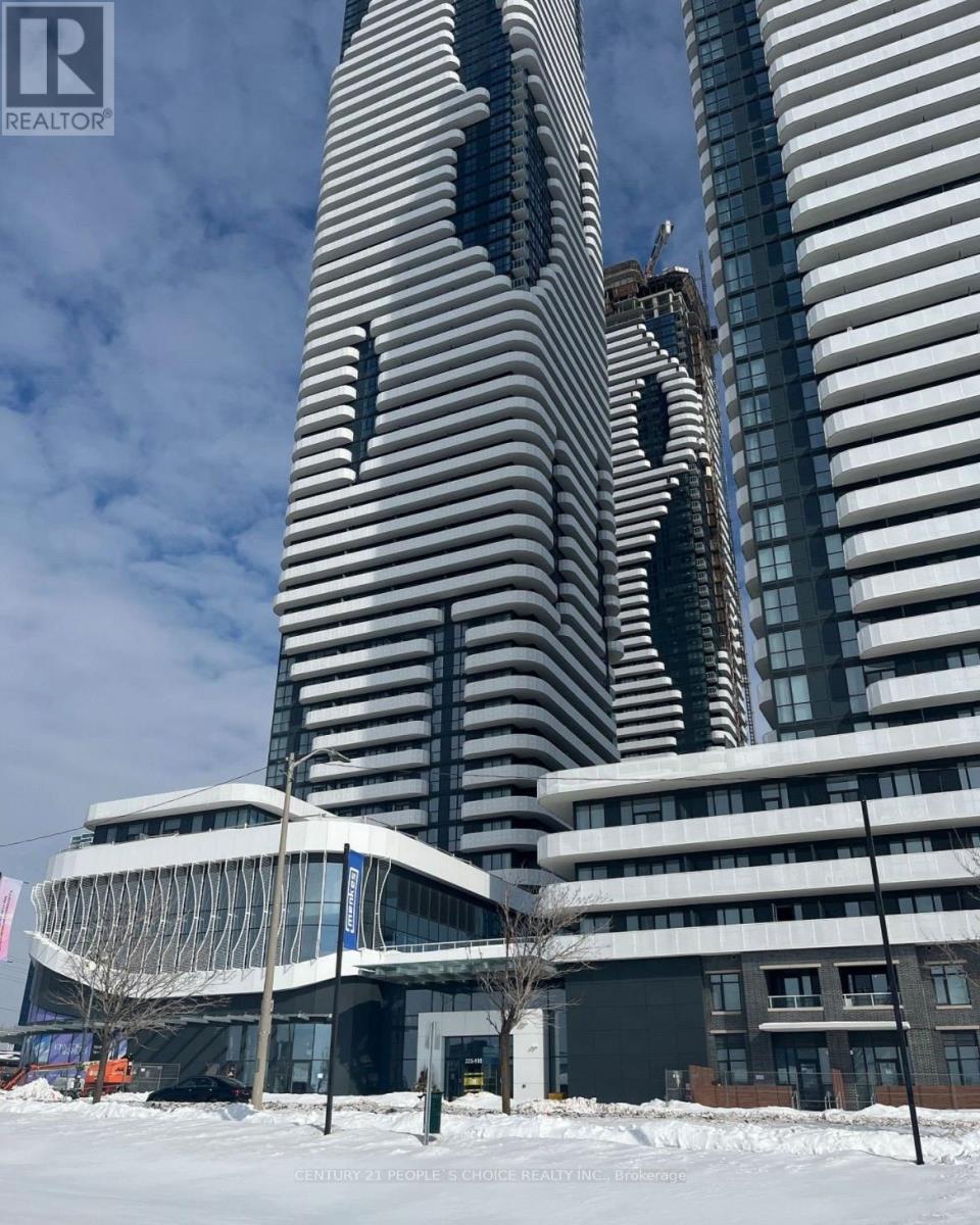 A tall building with a unique design stands next to a smaller building in a snowy landscape.