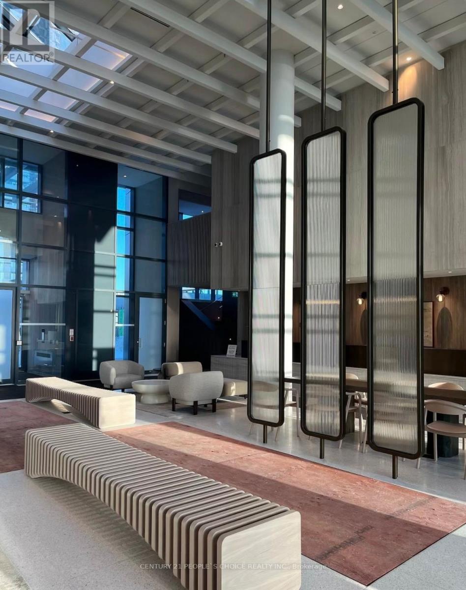 A modern interior space with a long bench and tall vertical panels.
