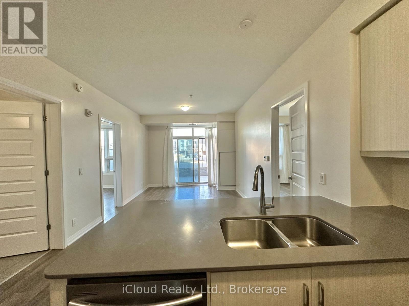 A kitchen with a sink and a countertop.