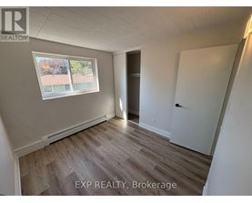 A room with EXP Realty, Brokerage written on the floor.