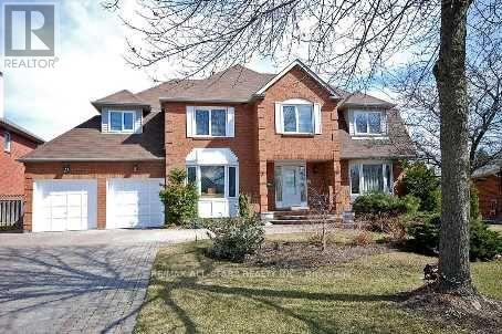 A large brick house with a white garage door.