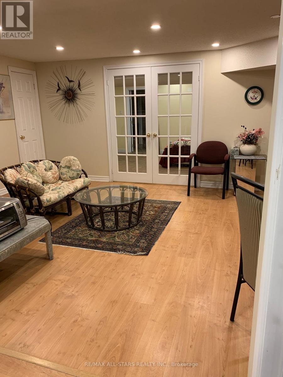 A living room with a couch, chair, and coffee table.