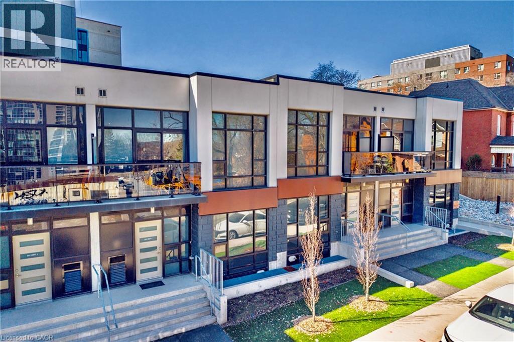 A modern building with the word REALTOR on the top left corner.