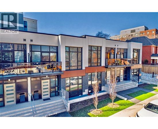 A modern building with the word REALTOR on the top left corner.