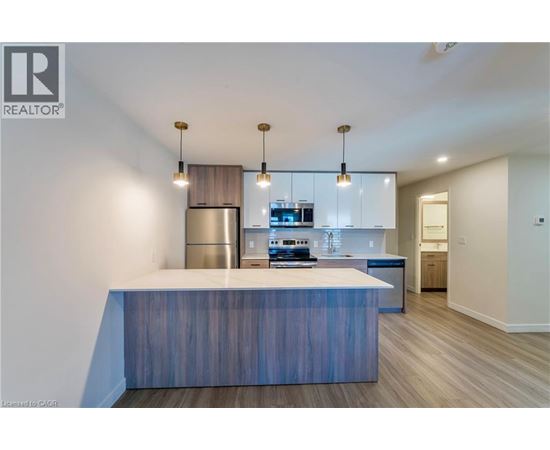 A modern kitchen with a large island in the middle.