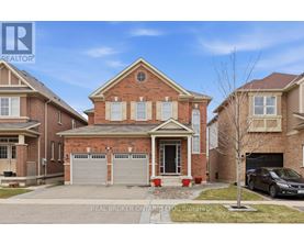 A house with a brick facade and a car parked in front.