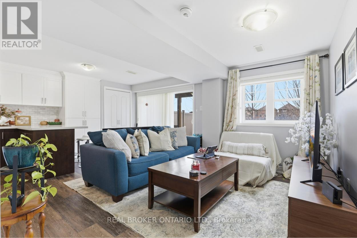 A living room with a blue couch and a wooden coffee table.