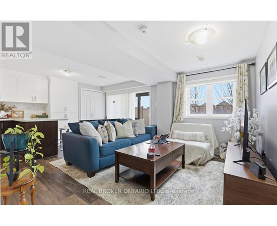 A living room with a blue couch and a wooden coffee table.