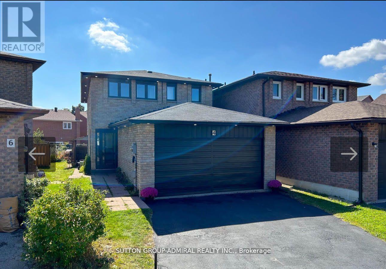 A modern house with a garage is for sale.