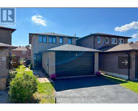 A modern house with a garage is for sale.