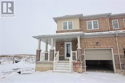 A house with a sign that says Flynn Realty.