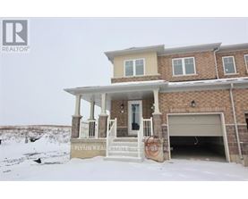 A house with a sign that says Flynn Realty.