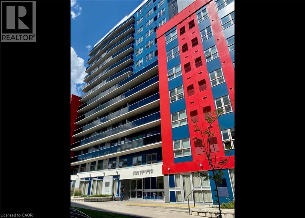 A tall building with a red section in the middle.